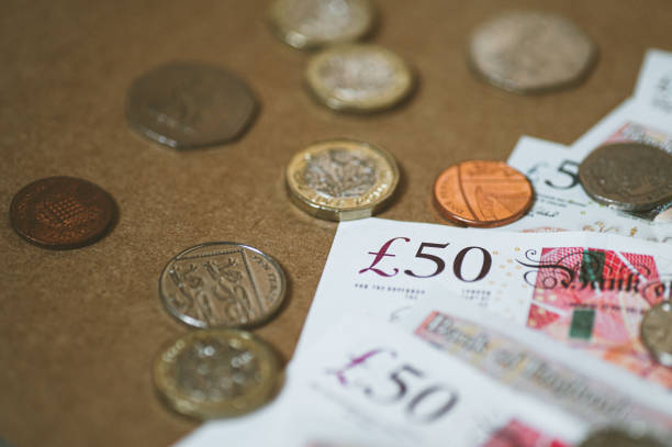 istock Great Britain Pound currency paper and coins 1282337705