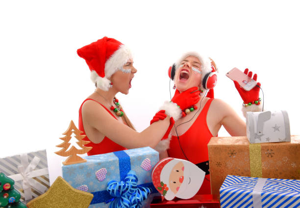 istock Santa Dressed Teens Listen To Music 1282337761