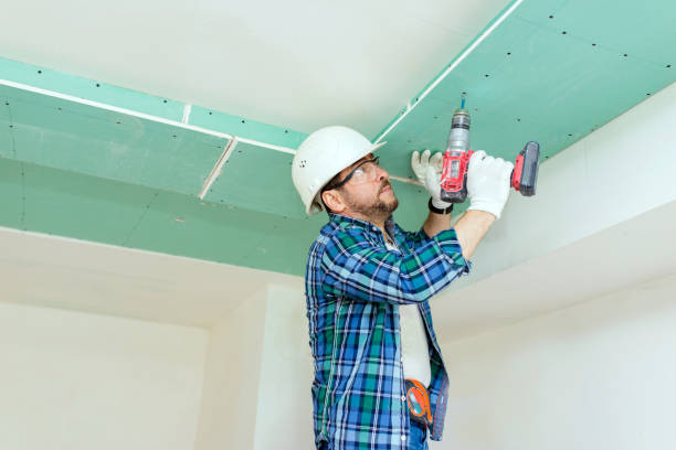 istock The builder will tighten the screws with an electric screwdriver 1282338736