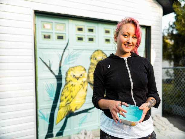 istock Female mural artist at work 1282339318