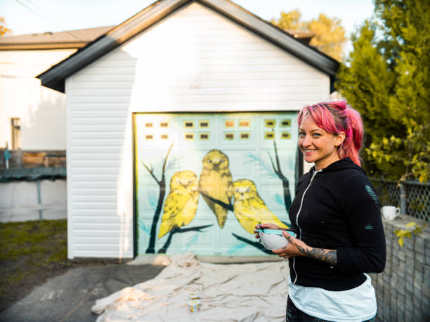 istock Female mural artist at work 1282339604