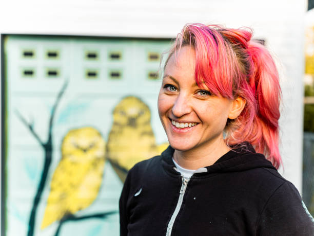 istock Female mural artist at work 1282340268