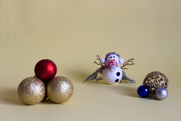 istock Christmas decorations and snowman on a yellow background 1282340646