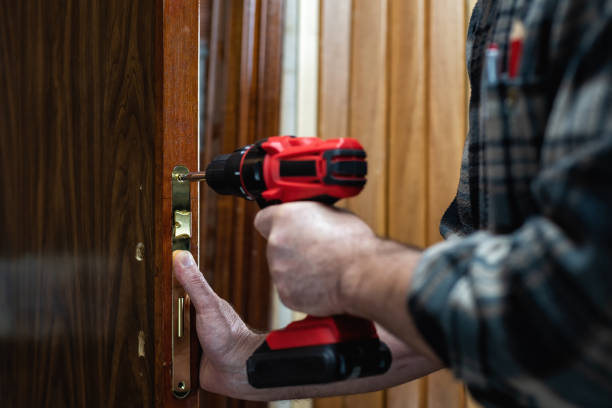 istock Carpenter at work repairs the door lock. Carpentry. 1282340867
