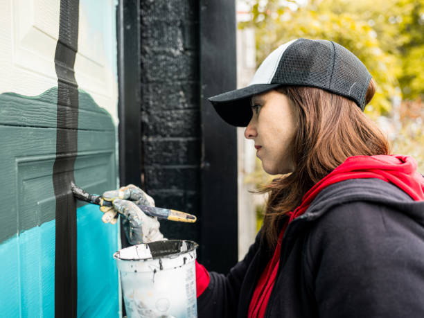 istock Female mural artist at work 1282340874