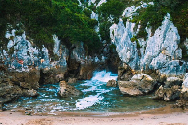 Gulpiyuri beach in Asturias (Spain), an inner beach behind the mountain