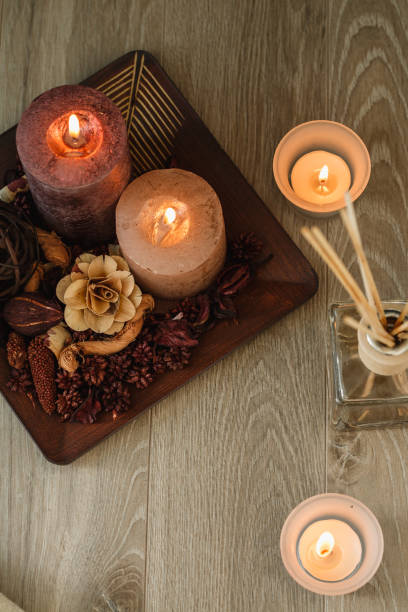 istock Directly above lit decorative candles on a wooden floor 1282342372