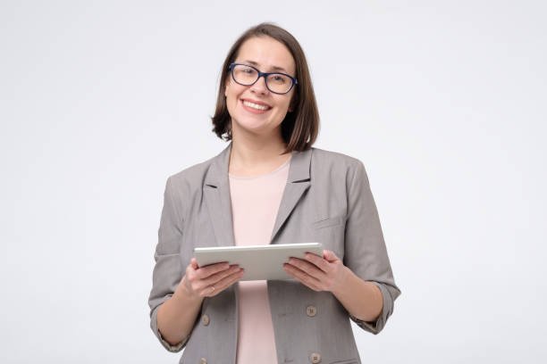 istock Portrait of a smiling businesswoman using a tablet computer. 1282343016