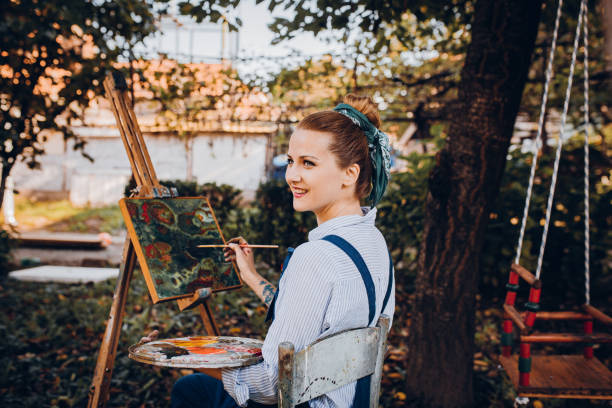 istock A female painter enjoys the yard 1282343063