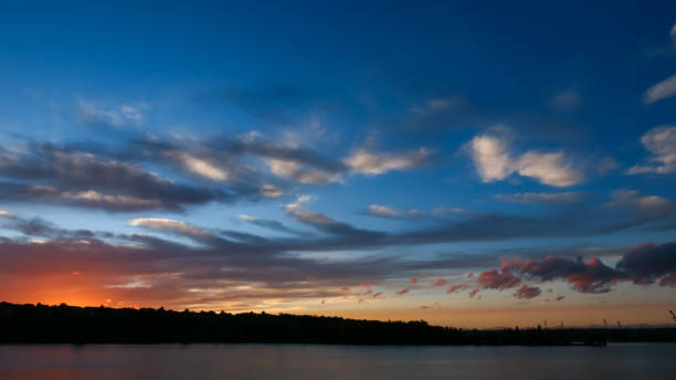 istock Amazing sunset in front of the water. 1282343594