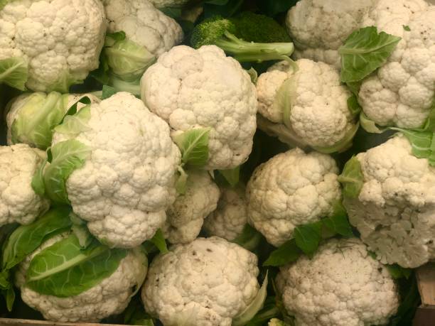 istock Cauliflower with green leaves 1282344816