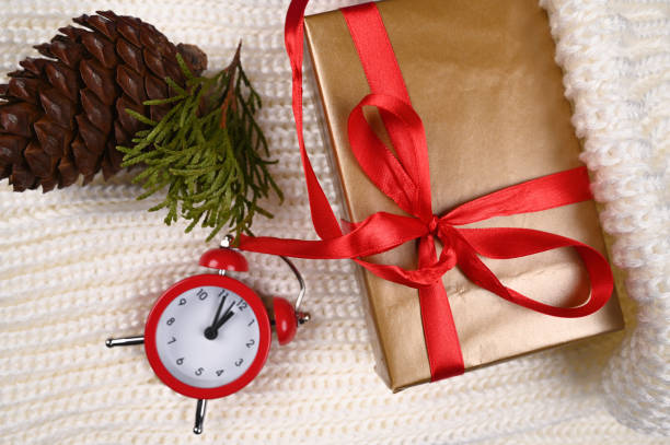 istock Red watch with gift wrapping and warm knitted fabric 1282345206
