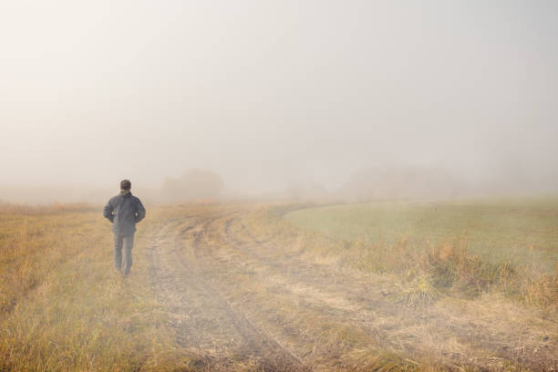 istock men silhouette in the fog 1282345359
