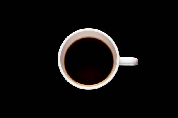 istock White cup of coffee on a black background. 1282345444