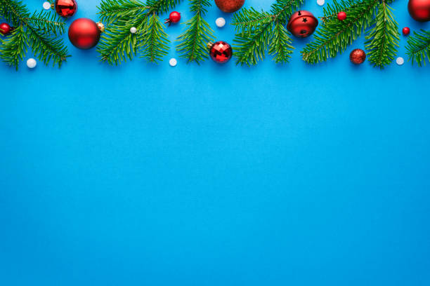 istock Blue christmas background with decorative frame of christmas tree decorations 1282345966