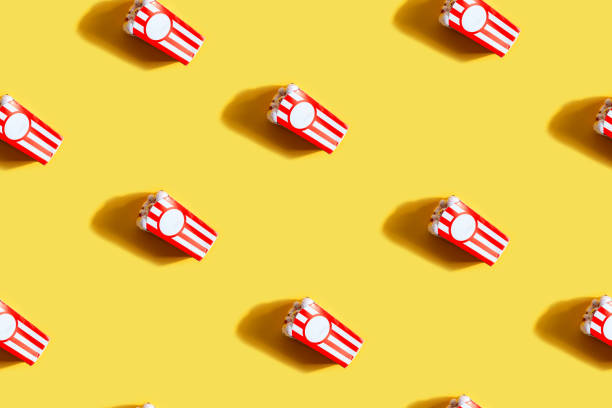 istock seamless pattern with box of popcorn eyes as halloween background 1282348039