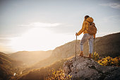 Young woman hiker enjoying in the landscape view