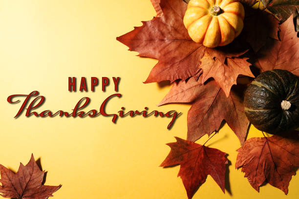 istock Happy Thanksgiving Day with maple leaves, nut and pumpkin on blu 1282349413