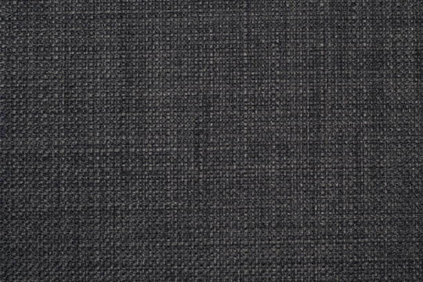 istock The background is a rough, dense linen fabric with a distinct braid weaving in black and gray shades. 1282350166