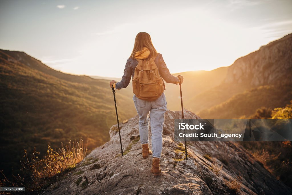 Woman Hiking On A Beautiful Autumn Day Stock Photo - Download