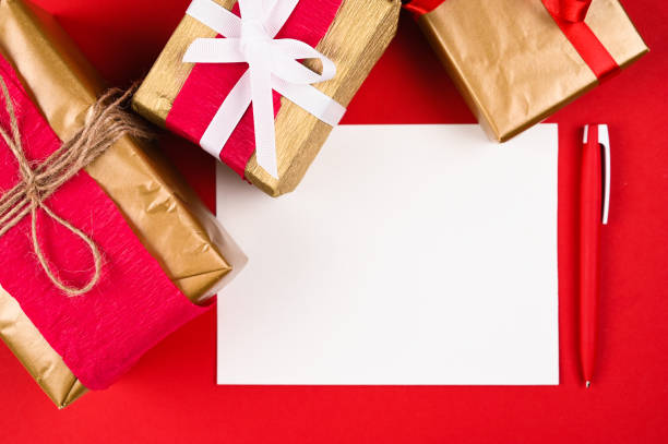 istock Red pen with paper on a Christmas background 1282354473