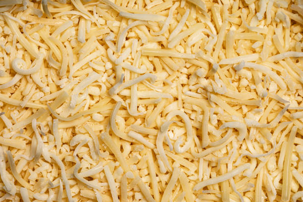 istock Full frame top view of yellow grated cheese 1282354673