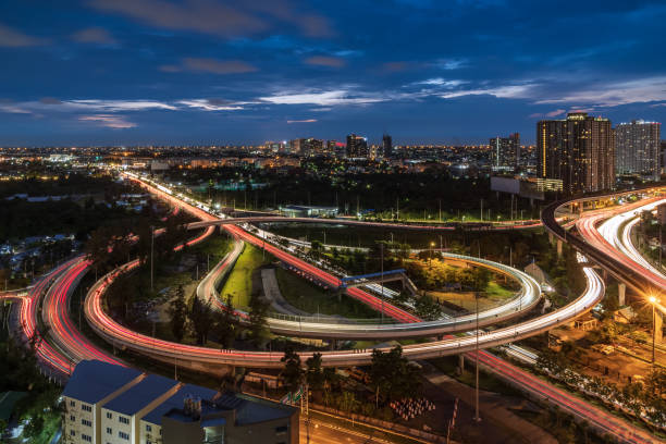 istock Elevated road junction interchange overpass expressway in Bangkok during twilight 1282355517