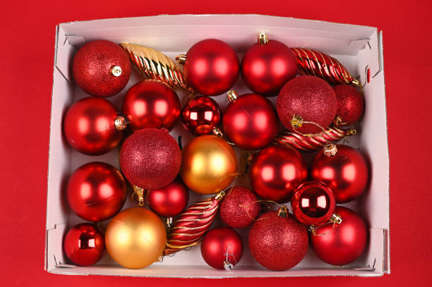 istock Red Christmas balls in a cardboard box 1282355646