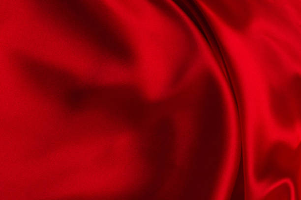 istock Red silk or satin luxury fabric texture can use as abstract background. 1282356901