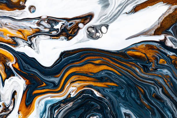 istock Fluid art texture. Abstract background with mixing paint effect. Liquid acrylic picture with flows and splashes. Mixed paints for interior poster. White, navy blue and golden overflowing colors. 1282358600