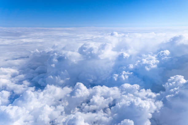 istock Clouds and sky as seen through the plane window. background, space for copy space 1282358718