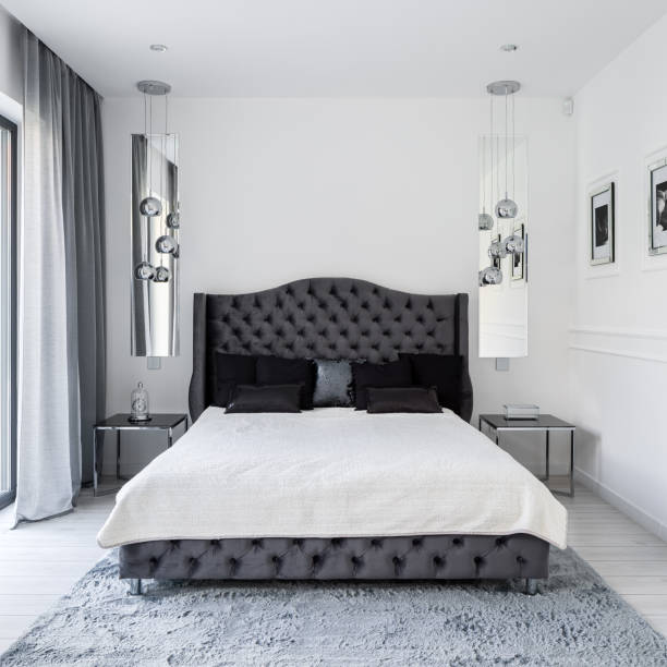 istock Glamour style bed in white bedroom 1282358936