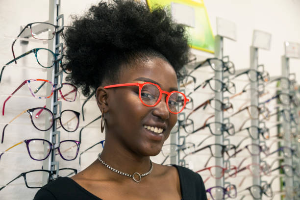 istock Young customer choosing eyeglasses in store 1282360450