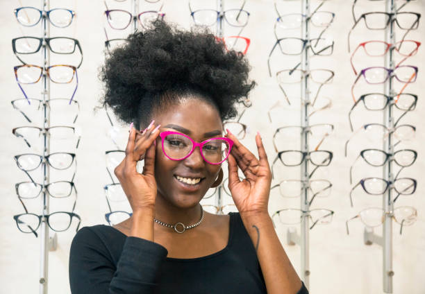 istock Young customer choosing eyeglasses in store 1282360452