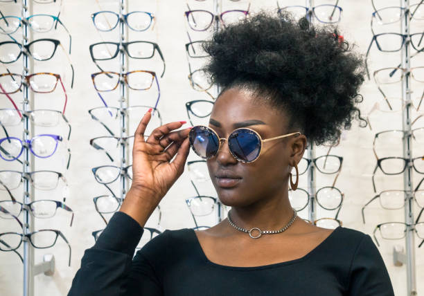 istock Young customer choosing eyeglasses in store 1282360466