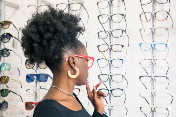 istock Young customer choosing eyeglasses in store 1282360482