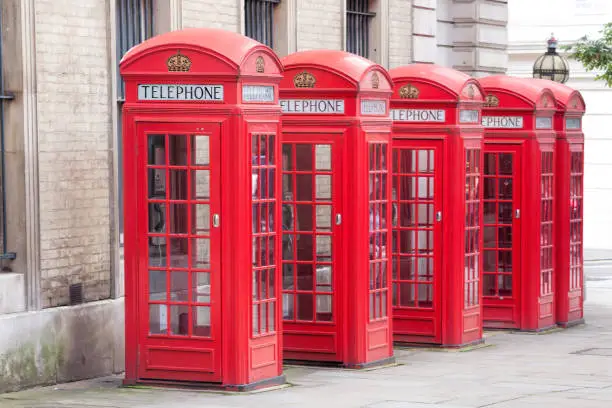 Photo of Famous red telephone booths in Covent Garden street, London, England