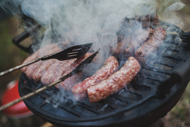 istock Extended family enjoying in the backyard preparing barbecue 1282362786