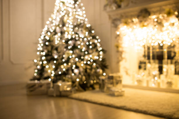 istock Blurred background. Three elegant Christmas trees in a bright room. New Year's and Christmas 1282362981