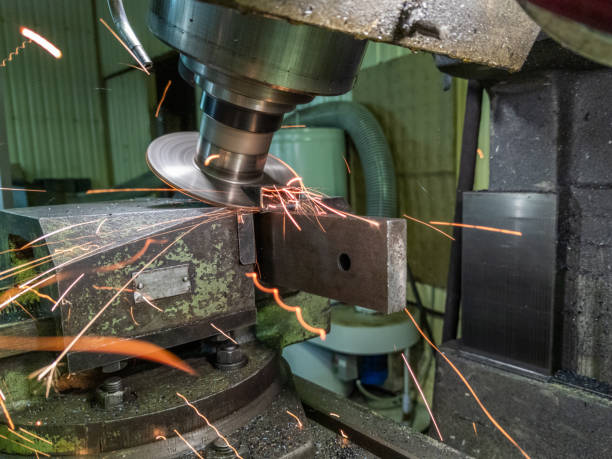 istock sloped disk industrial milling process with sparks - close-up with selective focus and blur 1282363227