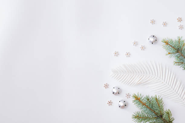 istock Flat lay frame with fir branches and christmas baubles decoration on a white background 1282365026