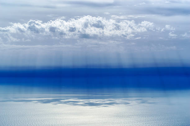 Panorama of the sea and sky from a high point. Clouds and sun rays