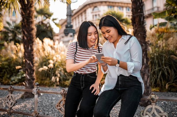 istock Young female tourists using a mobile phone 1282368007