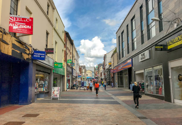 Merthyr Tydfil, Wales - August 2018: Main shopping street in Merthyr Tydfil town centre in South Wales with signs advertising shops to let