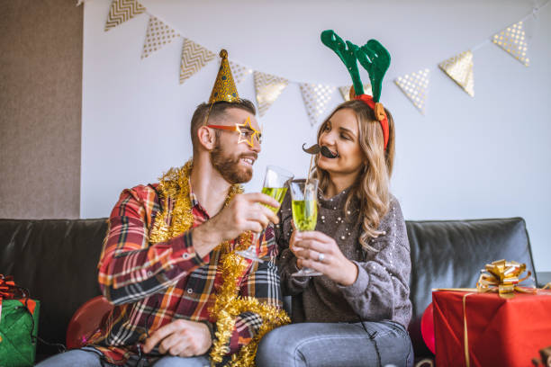 istock Couple celebrating Christmas at home and having  fun 1282373272