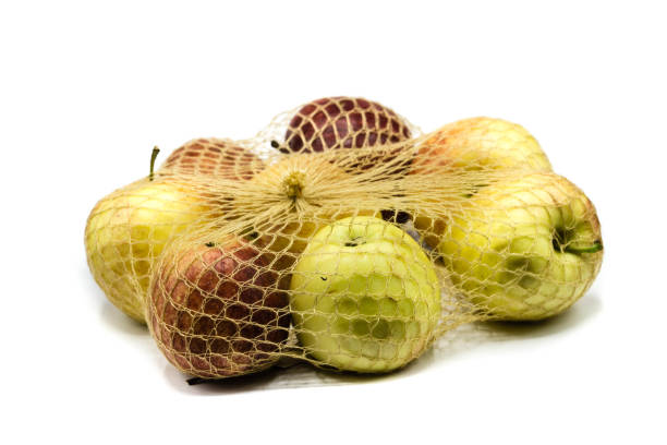 istock Apples in the net isolated on white background 1282373853