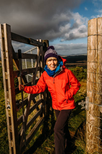 istock Woman passing through a country gate 1282374047