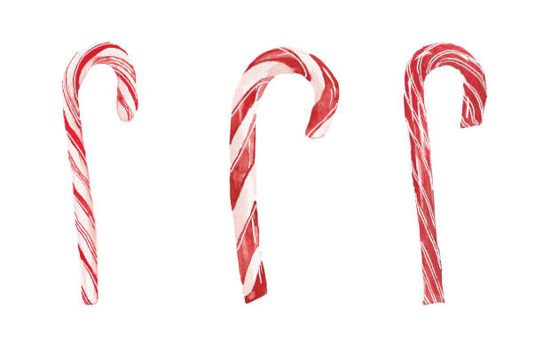 Watercolor Christmas Candy Canes Isolated on White Background Three Christmas candy canes painted in watercolor. This watercolor painting is isolated on a white background. december clipart pictures stock illustrations