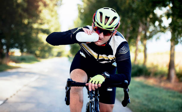 istock Hydration is important. Thirsty cyclist riding a bicycle. Sport and recreation concept 1282375799