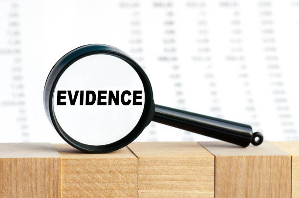 istock Look closely and Evidence with a magnifying glass , business concept image with soft focus background 1282376402